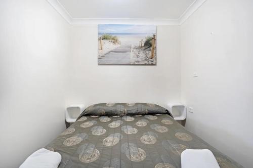 Letto o letti in una camera di Palm Valley Motel