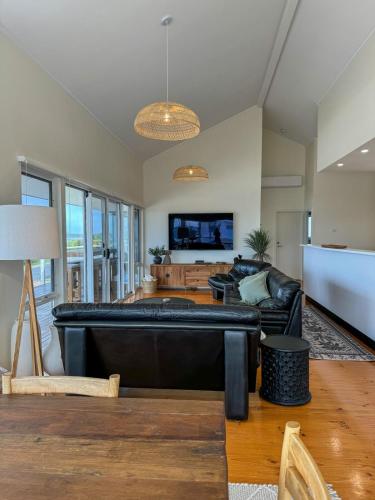a large living room with a large pool table at Océane Beach House Marion Bay South Australia in Marion Bay