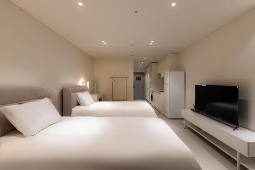 Postel nebo postele na pokoji v ubytování Hotel Modak Namdaemun