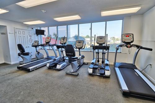 a gym with several treadmills and cardio machines at Oceanfront Crescent Shores #208-Sleeps 10 3bed 3bath 28 Foot Balcony in North Myrtle Beach