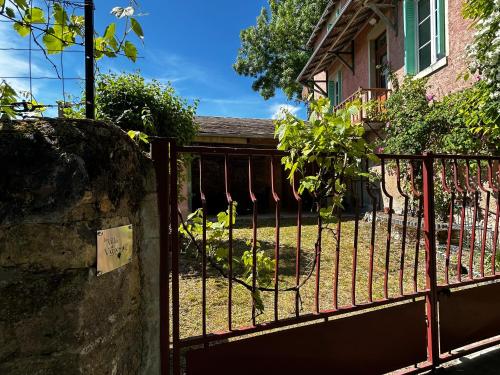 a iron fence in front of a house at Maison Rénovée avec Jardin et WIFI à La Roche-Posay - FR-1-541-173 in La Roche-Posay