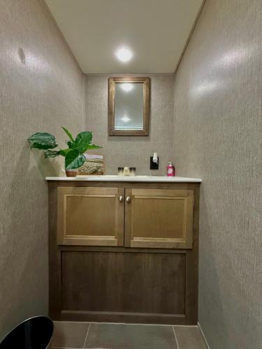 a bathroom with a sink and a mirror at La Gozadera Park RV 1 in Salinas