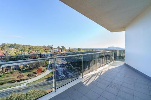 an empty balcony with a view of a street at Top-Floor Apartment Near Shops and Aboretum views - Hosted by Canstay in Phillip