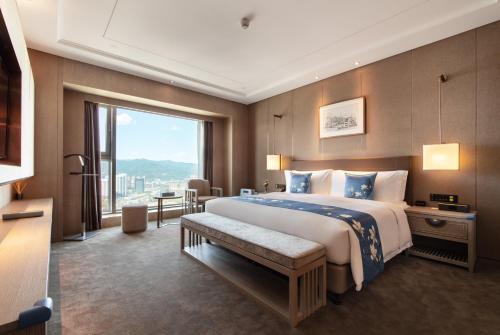 Katil atau katil-katil dalam bilik di Kunming Huiyue Wyndham Hotel
