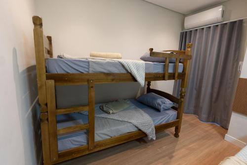 a bedroom with two bunk beds in a room at Hostel Village GRU in Guarulhos