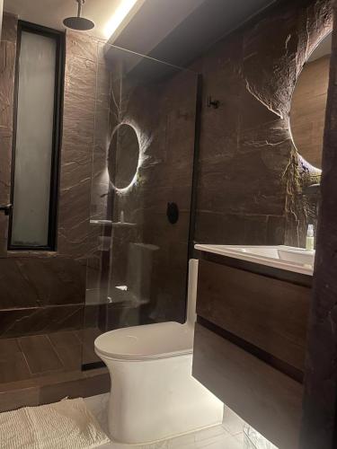 a bathroom with a shower and a toilet and a sink at Tarapoto Relax or Work Nomad Wifi Starlink in Morales