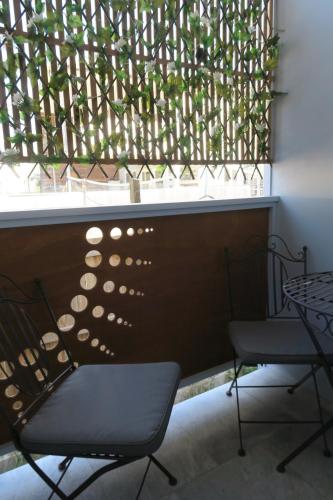 a table and two chairs in front of a window at St Caths Anchorage in Brisbane