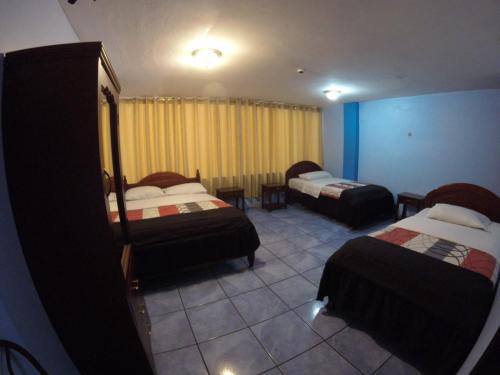 Postel nebo postele na pokoji v ubytování Hostal mariajose baños