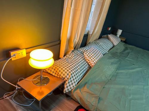 Ένα ή περισσότερα κρεβάτια σε δωμάτιο στο Elisa's Lofts La Union 12-pax