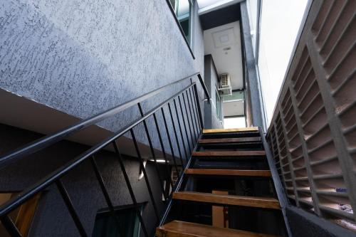 an overhead view of a staircase in a building at Hostel Village GRU in Guarulhos