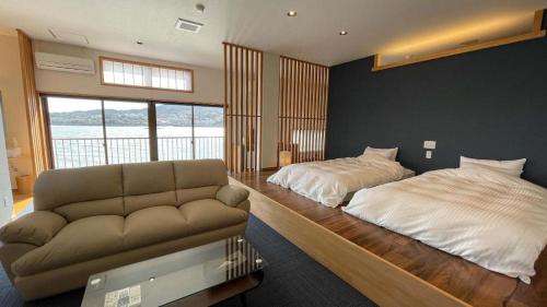 Postel nebo postele na pokoji v ubytování Tara Kanko Hotel