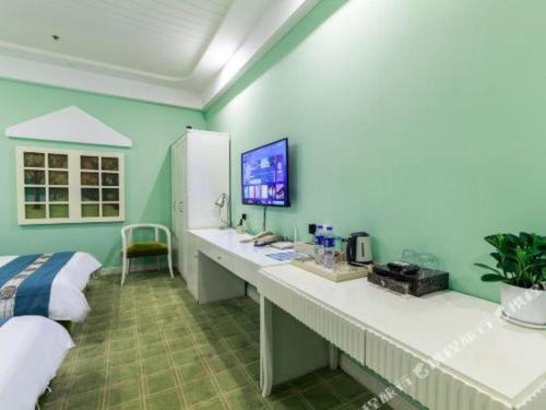 a bedroom with a bed and a desk in a room at TO915101 STILL LOVE THEME HOTEL in Chengdu