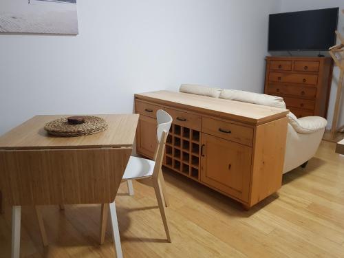a kitchen with a table and a table and a chair at St Caths Anchorage in Brisbane