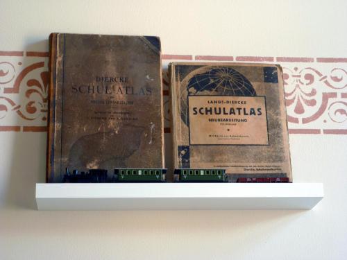 two old books are sitting on a shelf at Villa zur Erholung Bed & Breakfast in Bad Breisig