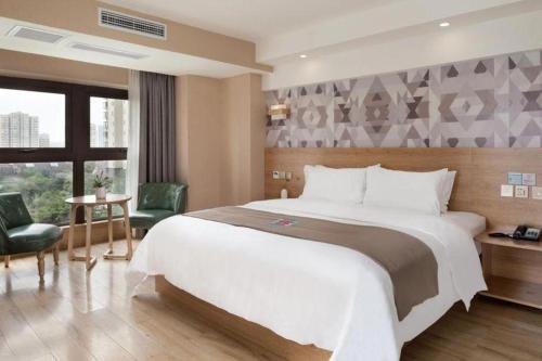 Ένα ή περισσότερα κρεβάτια σε δωμάτιο στο PAI Hotels·Jiangbei Airport Central Park