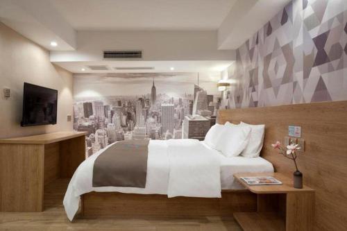 Кровать или кровати в номере PAI Hotels·Jiangbei Airport Central Park