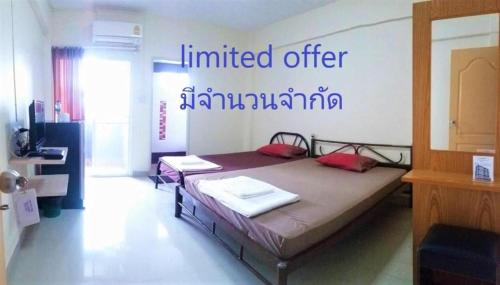 a bedroom with a bed in a room at New Home Nakhon Chai Si in Nakhon Pathom