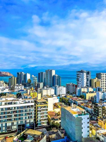 a view of a city with tall buildings at Ocean view 1 BR Miraflores with parking in Lima
