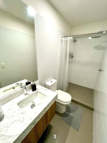 a bathroom with a sink and a toilet at Ocean view 1 BR Miraflores with parking in Lima