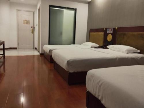 Ένα ή περισσότερα κρεβάτια σε δωμάτιο στο Shell Hotel Liaocheng Dongchang Xi Road Railway Station