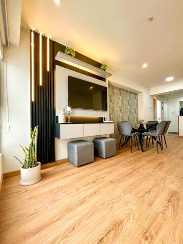 a living room with a table and a dining room at Ocean view 1 BR Miraflores with parking in Lima