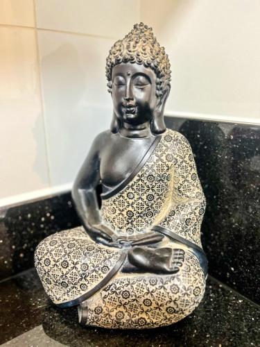 a statue of a woman sitting on a table at Ocean view 1 BR Miraflores with parking in Lima