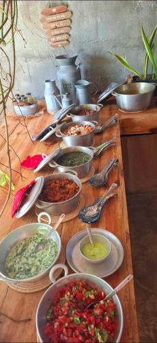 a table with many bowls of food on it at Kot Nou - Kwizine Mama Manze Lakaz in Mahébourg
