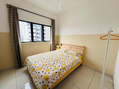 a bedroom with a bed and a window at SpongeBob lover Wi-Fi TV box in Cheras