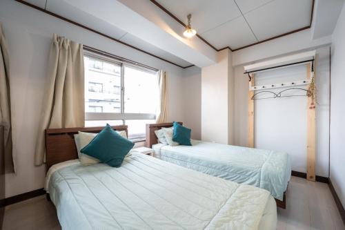 Una cama o camas en una habitación de くるみん-Kurumin501-