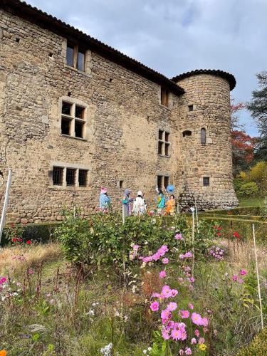 a group of people standing in front of a building at Château du Bouy in Champétières