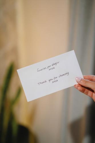 a person holding a piece of paper with a note at Casa Olivea in Valle de Guadalupe
