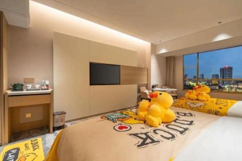 Zhangjiagang Guomao Hotelにあるベッド