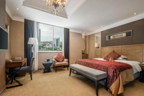 Zhangjiagang Guomao Hotelにあるベッド