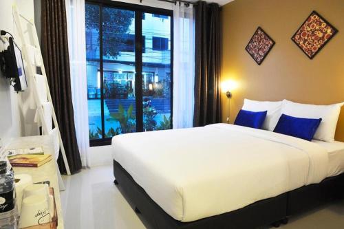 Ένα ή περισσότερα κρεβάτια σε δωμάτιο στο U Sleep Chiangmai