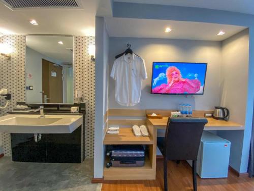 TV a/nebo společenská místnost v ubytování The Three Hat Yai