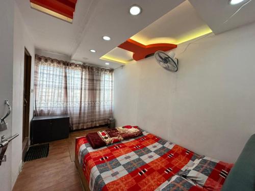 Ένα ή περισσότερα κρεβάτια σε δωμάτιο στο Hotel Rose Valley Panthapath