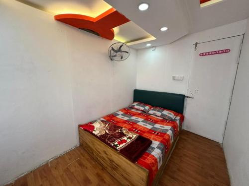 Ένα ή περισσότερα κρεβάτια σε δωμάτιο στο Hotel Rose Valley Panthapath