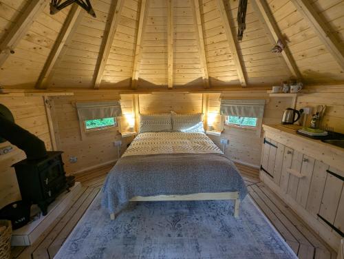 Ένα ή περισσότερα κρεβάτια σε δωμάτιο στο Bluebell Hideaway