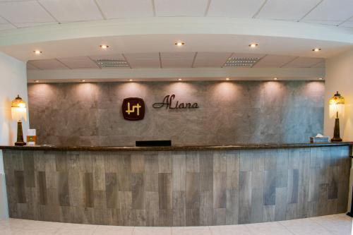 a bar in a hotel lobby with the name of a salon at Hotel Aliana in Salamanca