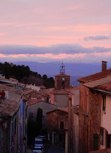 a view of a town with a clock tower at Apartment near St Tropez with pool in La Garde-Freinet