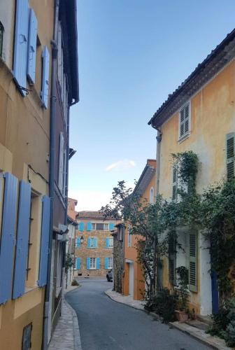 an empty street in an old town with buildings at Apartment near St Tropez with pool in La Garde-Freinet