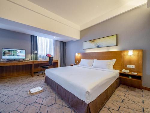 Ένα ή περισσότερα κρεβάτια σε δωμάτιο στο Uniton Hotel Shenzhen