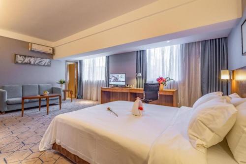 Ένα ή περισσότερα κρεβάτια σε δωμάτιο στο Uniton Hotel Shenzhen