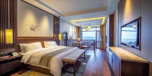 Katil atau katil-katil dalam bilik di Pingtian Bandao Hotel