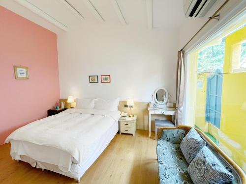 Ein Bett oder Betten in einem Zimmer der Unterkunft Alishan Tea Garden B&B