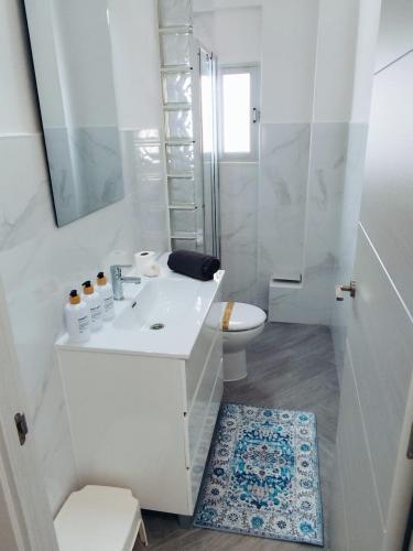 a bathroom with a sink and a toilet and a shower at Paradis Calpe in Calpe