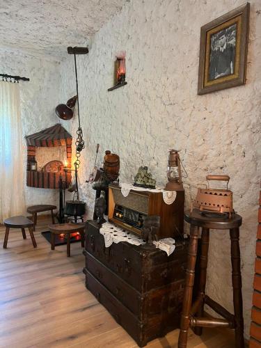 a room filled with furniture and a room with a bed at Sailor's Rustic House in Virpazar