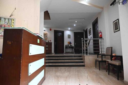 a hallway with stairs and a stair case at Phoenix Hospitality in Gurgaon