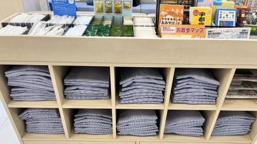 a shelf full of towels in a store at Toyoko Inn Tobu Utsunomiya eki Nishi guchi in Utsunomiya