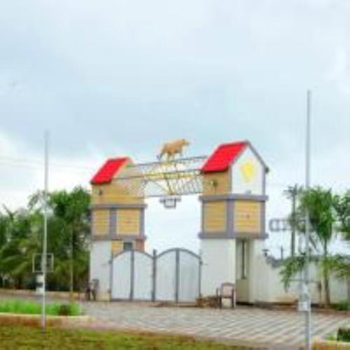 a building with a dog on top of it at VITS Select Diamond Resort Sasan Gir in Talala